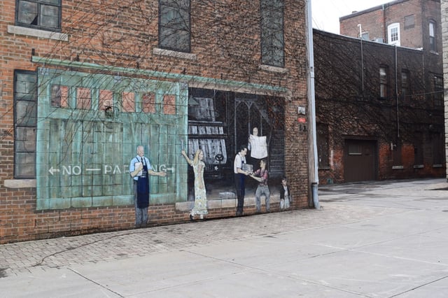 Downtown Batavia, with local artwork and murals painted on buildings in the town square.